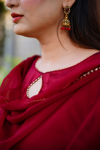 Indulge in the timeless elegance of our maroon Farshi shalwar set